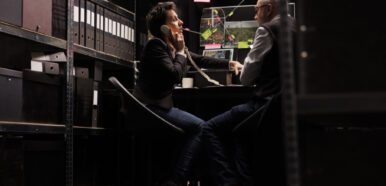 Woman police officer talking at landline phone